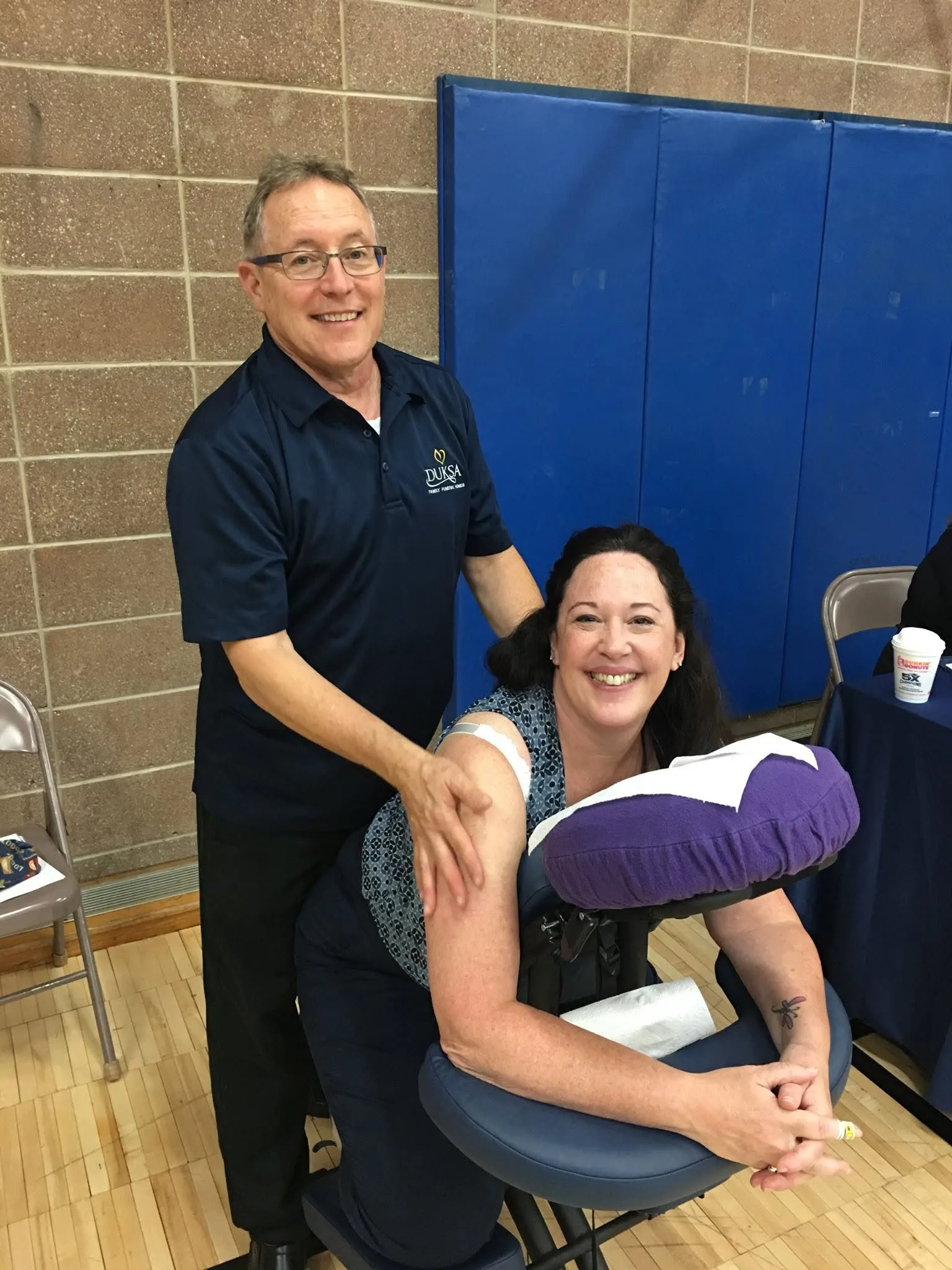 Stephen A. Casillas providing chair massage at a community event